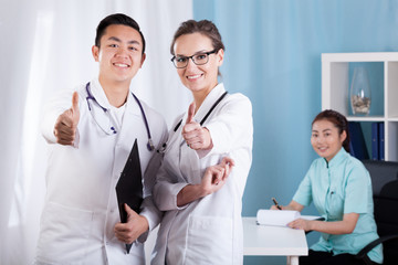 Wall Mural - Medical personnel showing thumbs up sign