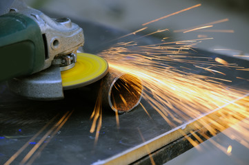 Wall Mural - Worker cutting metal with grinder