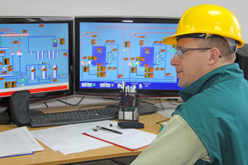 Wall Mural - Industrial worker in control room