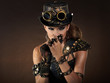 © ZoomTeam - Portrait of a beautiful steampunk woman over smoke background.