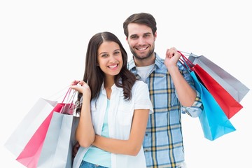 Poster - Attractive young couple with shopping bags