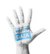 Open hand raised, Pray for Gaza sign painted