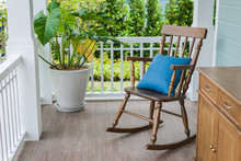 Wooden Rocking Chair On Front Porch
