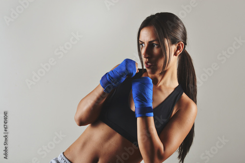 fitness woman with the blue boxing bandages, studio shot Lerretsbilde