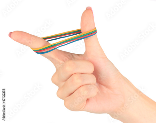 Fotografía Colorful rubber bands in hand isolated on white