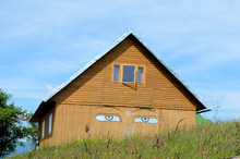 A Quaint House With Painted Eyes On The Front
