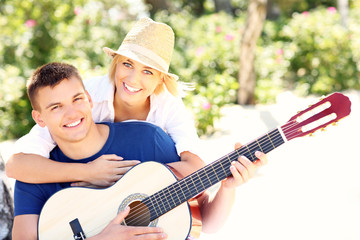 Wall Mural - Joyful couple and guitar