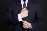Fototapeta  - businessman with ace card hidden under sleeve