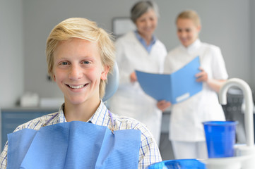 Wall Mural - Teenage patient at dental surgery dentist nurse