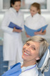 © CandyBox Images - Senior woman patient at dentist surgery smiling