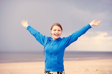 Teen girl having fun on the beach