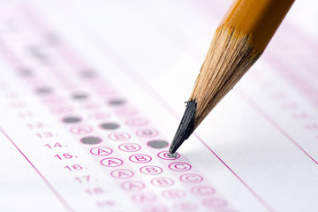 multiple choice examination form with yellow pencil
