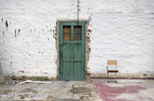 Old White Brick Wall With Green Door