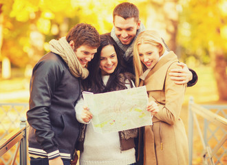 Canvas Print - couples with tourist map in autumn park