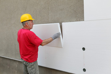 styrofoam, polystyrene thermal insulation of house wall install