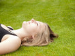 © Wouter Tolenaars - Beautiful Teenage Girl lying on her back in the green grass