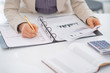 © Alliance - Closeup on business woman working with documents