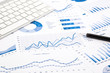 © vinnstock - blue graph and chart reports on office table