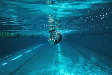 Athletic swimmer training on her own