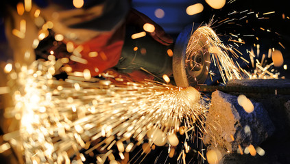 Wall Mural - Worker cutting metal with grinder