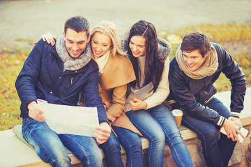 Canvas Print - couples with tourist map in autumn park