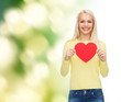 © Syda Productions - smiling woman with red heart