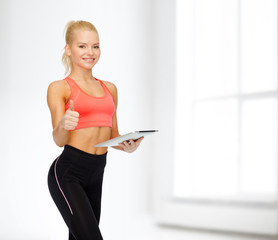 Sticker - smiling sporty woman with tablet pc computer