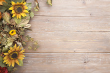 Fall Border With Sunflowers On A Grunge Wood Background