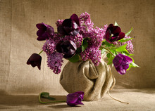 Beautiful Bouquet Of Tulips With Sprigs Of Lilac In A Vase On A
