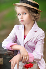 Wall Mural - portrait of little girl outdoors in summer