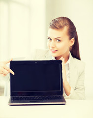 Wall Mural - businesswoman with laptop in office