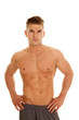 © Poulsons Photography - man no shirt stand hands hips looks serious