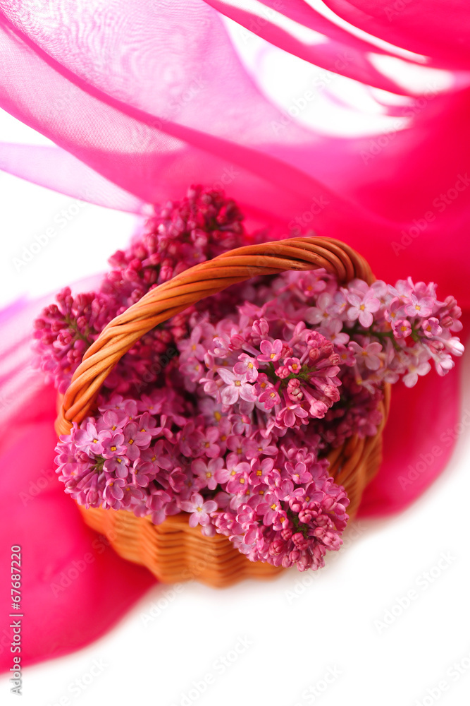 Beautiful lilac flowers in wicker basket