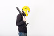© singulyarra - Young man in yellow helmet and black jacket with bat