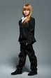 Little fashionable girl in black costume isolated