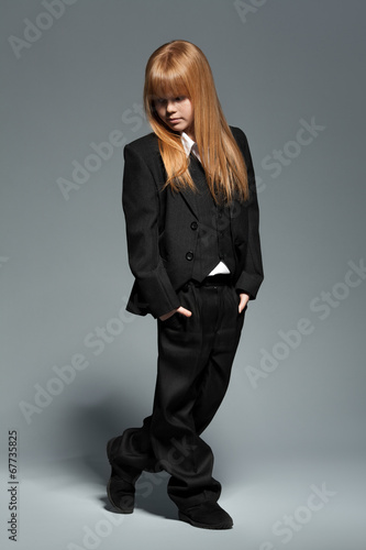 Naklejka - mata magnetyczna na lodówkę Little fashionable girl in black costume isolated