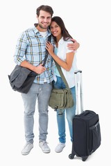 Poster - Attractive young couple going on their holidays