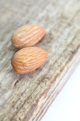 Sticker - close - up almond seeds  on wood background