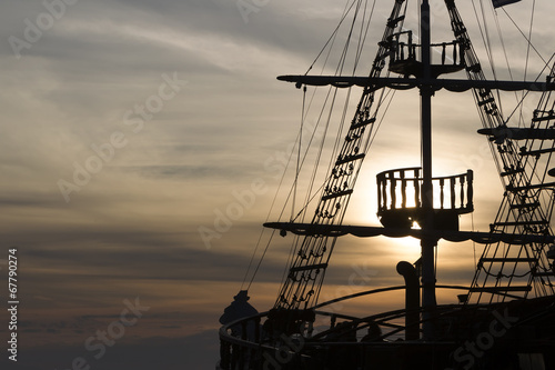 Fotografie, Obraz Silhouette of sails of an antique ship, masts and bowsprit of a
