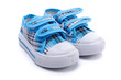 Blue sneakers for a baby on white background