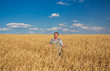 © Ryzhkov Oleksandr - farmer standing in a wheat field