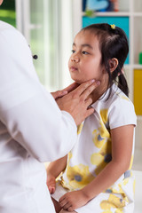 Wall Mural - Pediatrician examining lymph nodes