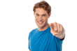 © stockyimages - Cheerful man pointing towards camera