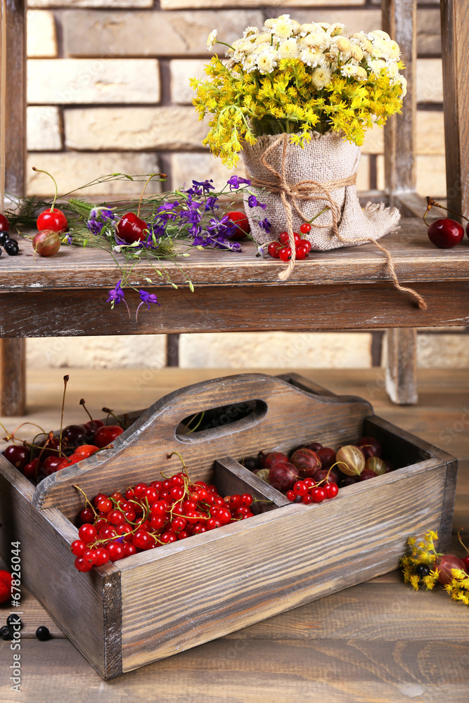 Fresh berries in wooden box, close up