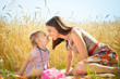 © spass - Happy young mother with little daughter on field in summer day