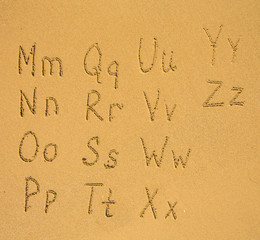 Wall Mural - Alphabet written on a sand beach.(M-Z) 2/2