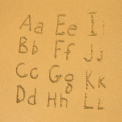 Poster - Alphabet written on a sand beach (A-L) 1/2