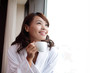 © ryanking999 - attractive woman holding a cup of coffee, smiling.