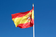 Spanish Flag Against Blue Sky