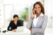 © michaeljung - african american businesswoman talking on smart phone
